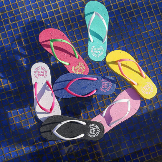Lightweight women’s beach flip flops with red PE sole
