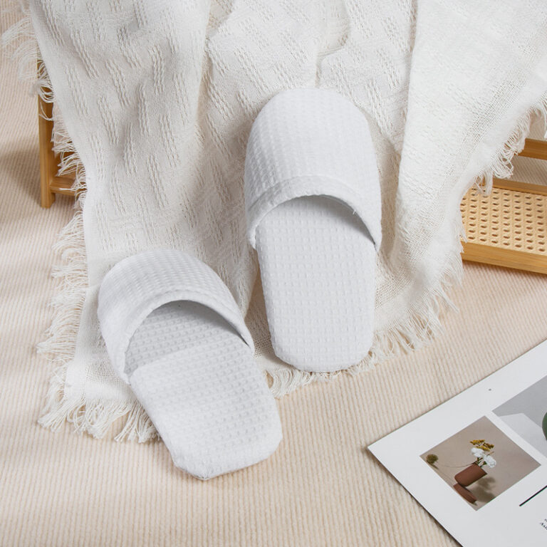 white terry hotel slippers